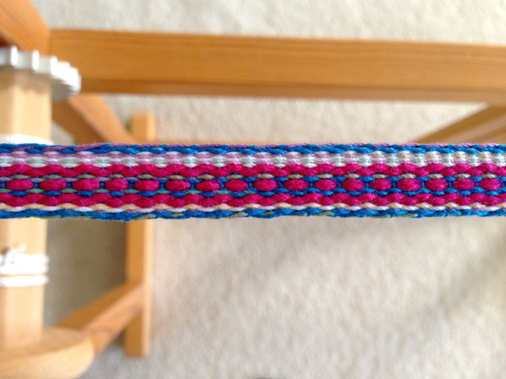 Colorful band woven on two-treadle band loom.