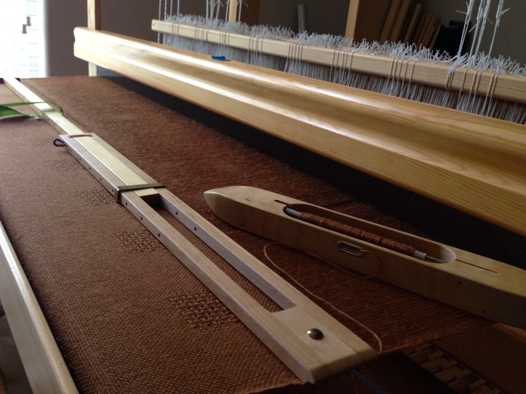 Alpaca/Tencel throw on the loom. Plain weave, with lace weave squares.