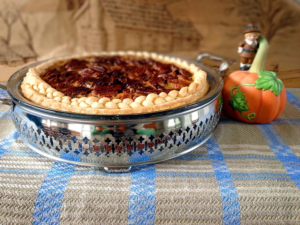 Handwoven eight-shaft two block twill cloth holds special Pecan Pie with braided-edged crust. Perfect finale for Thanksgiving dinner.