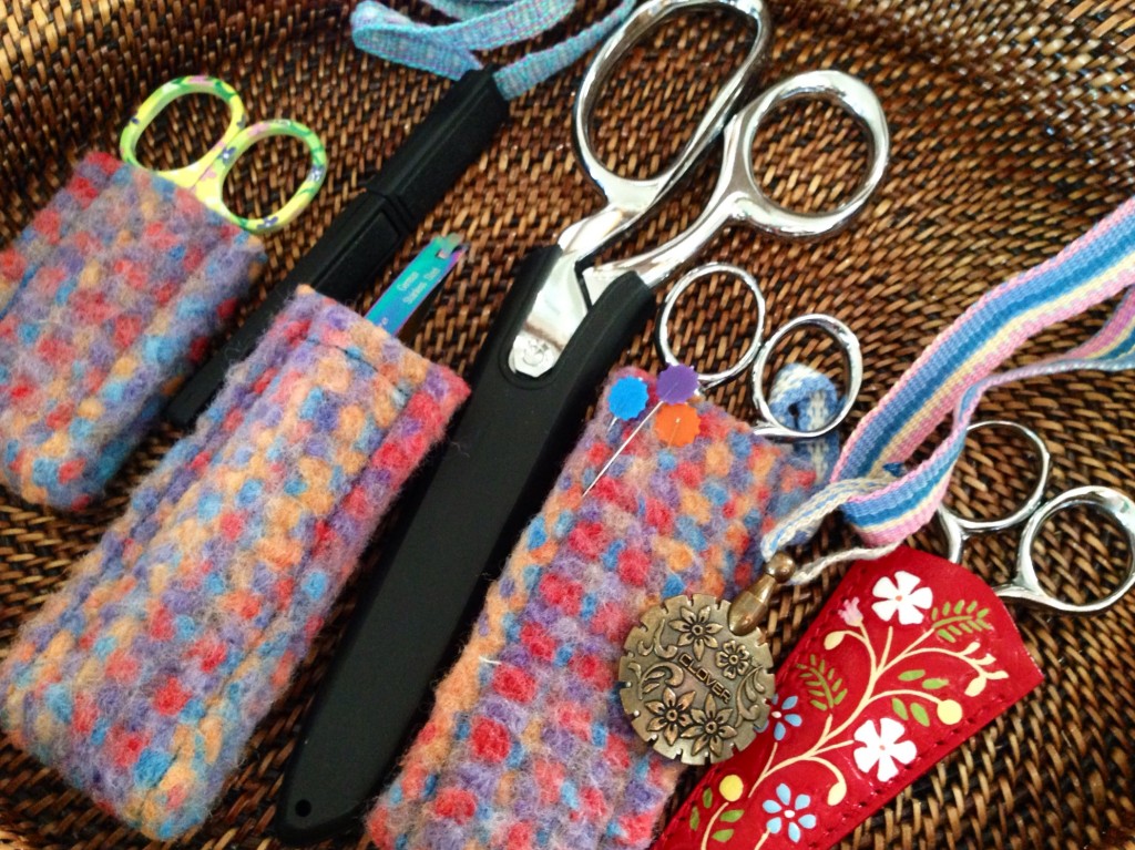 Collection of scissors and their sheaths.