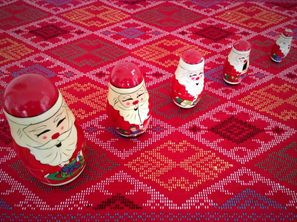 Handwoven design, unique to the Philippines, holds vintage Santa display.
