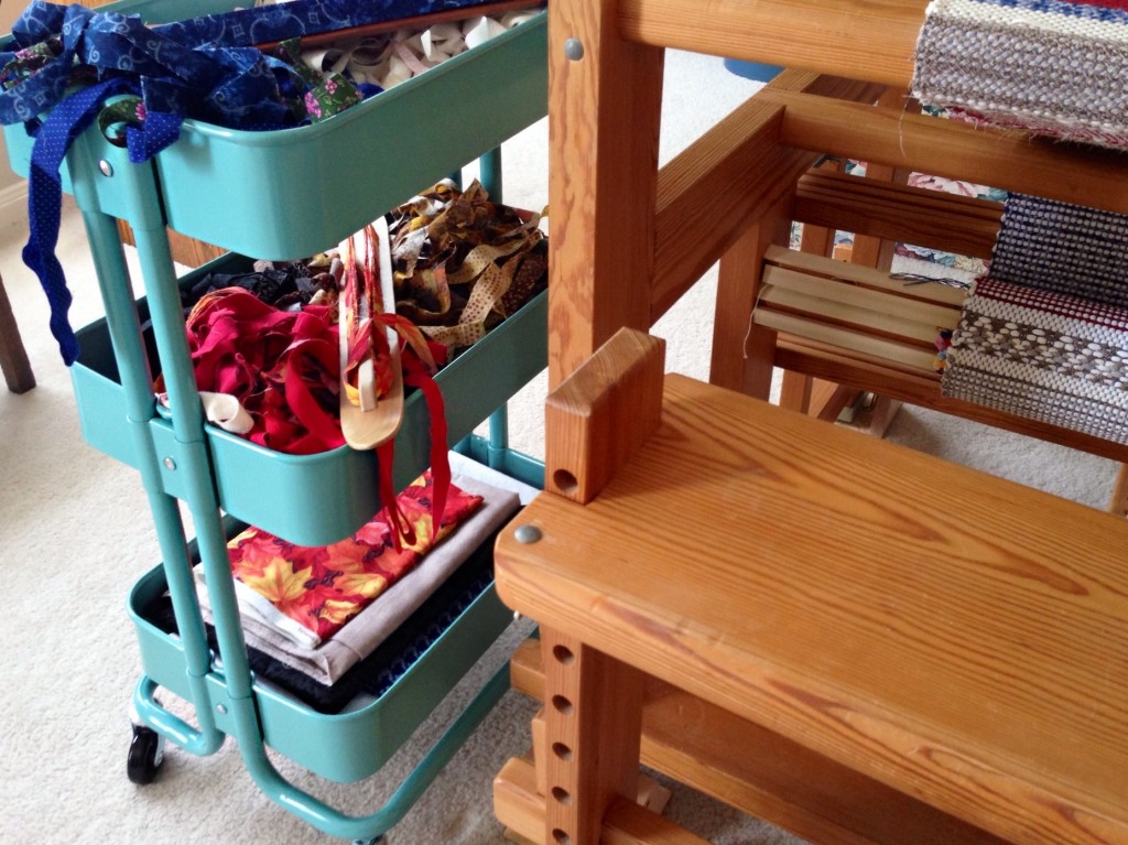 Ikea cart beside the loom while weaving rag rugs.