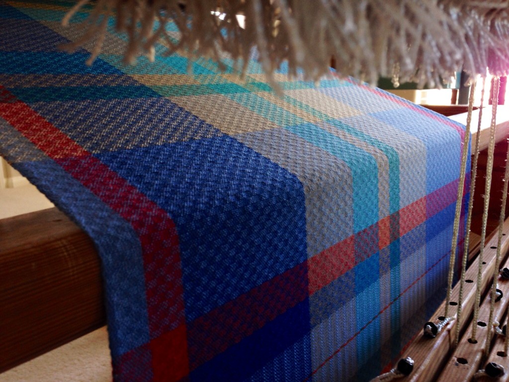 Cotton handtowels on the loom. View from back of loom under the warp.