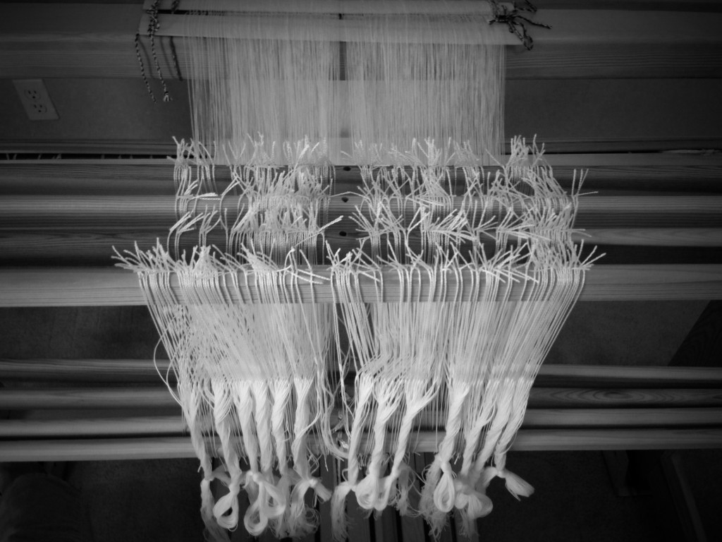 Heddles threaded with doubled threads of 20/2 cotton.