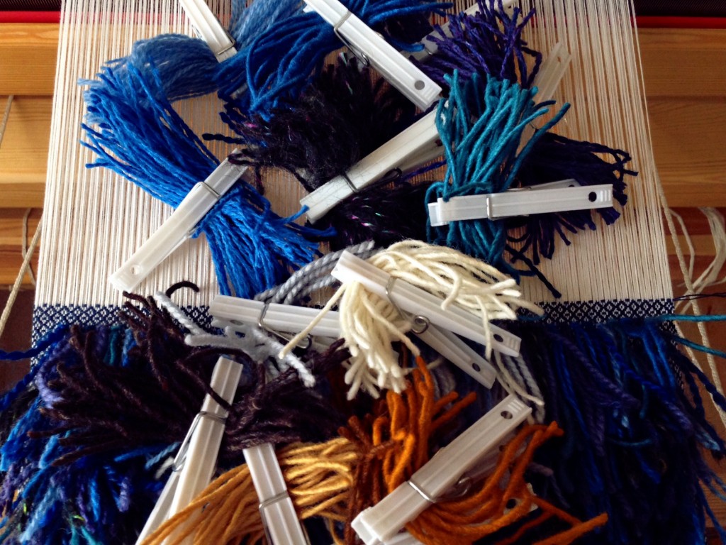 Assortment of wool yarn separated for planning rya knots. How-to pics.