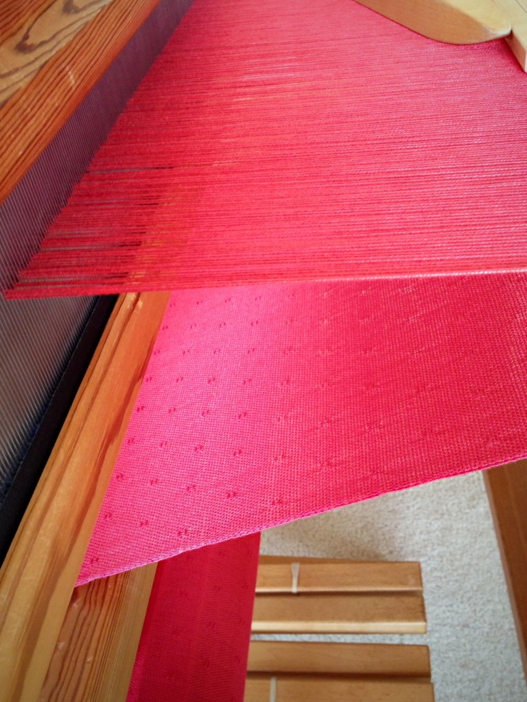 Coral pink bamboo shawl in huck lace.