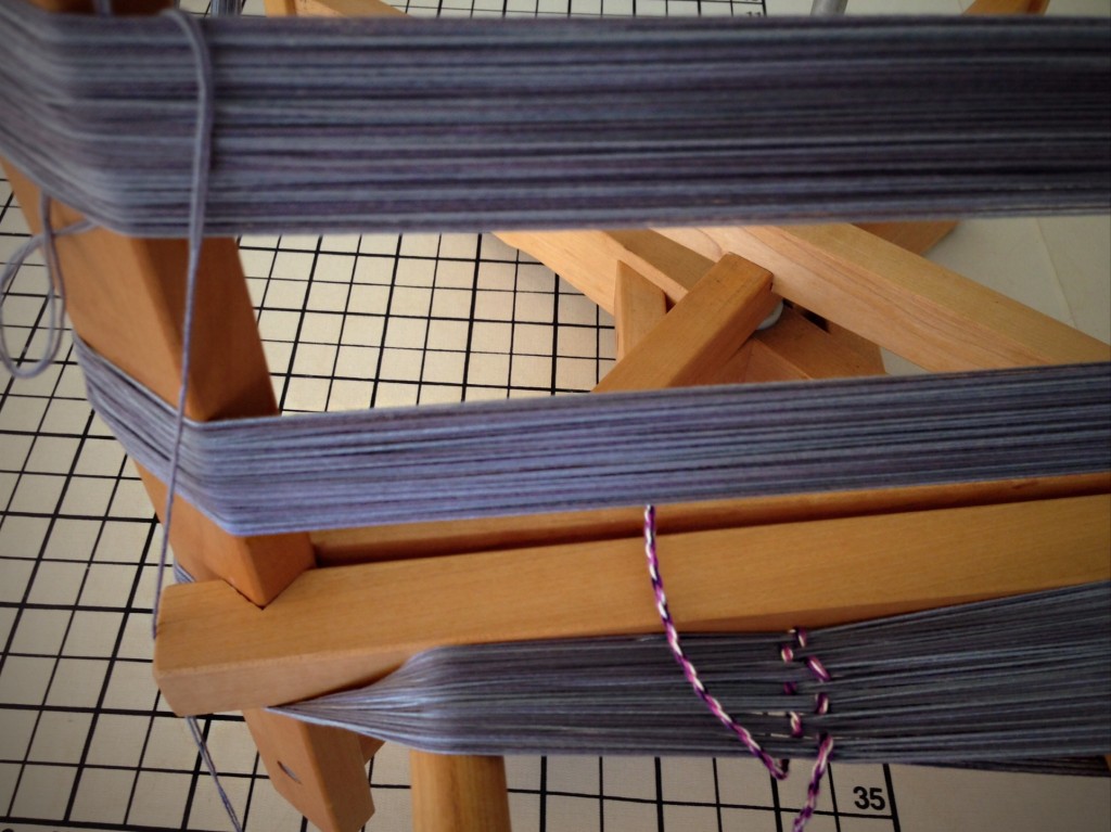 Winding rug warp on warping reel.