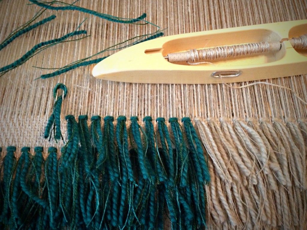 Forming rya knots in coarse linen fabric.