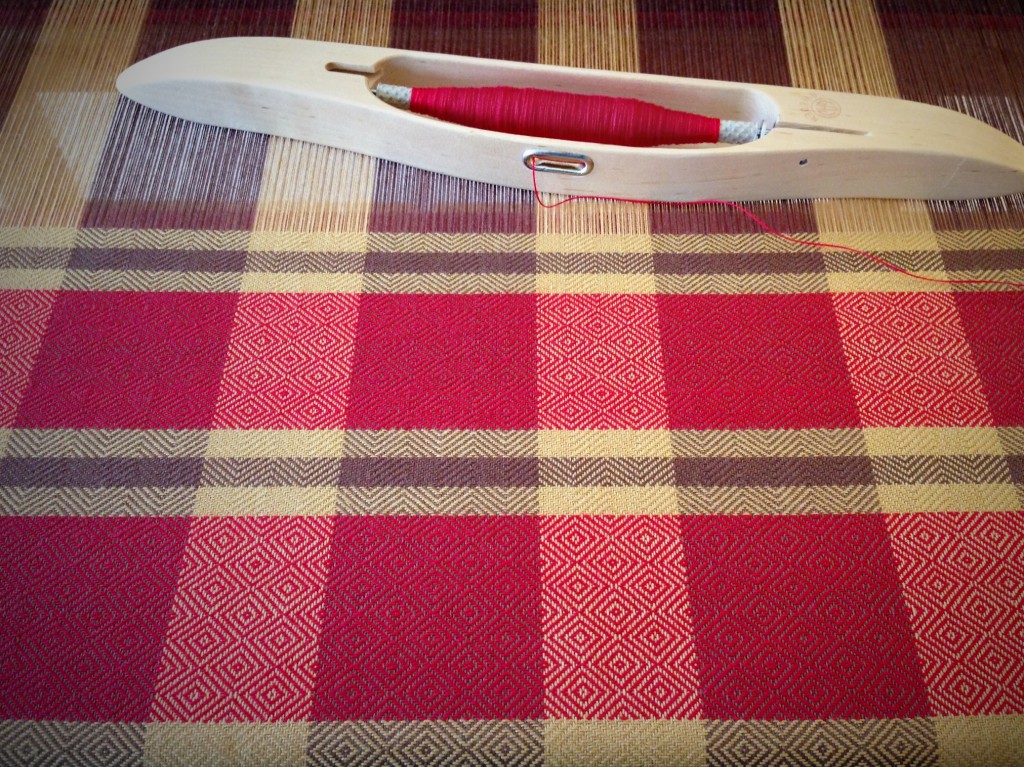 Red and brown goose-eye towel on the loom.