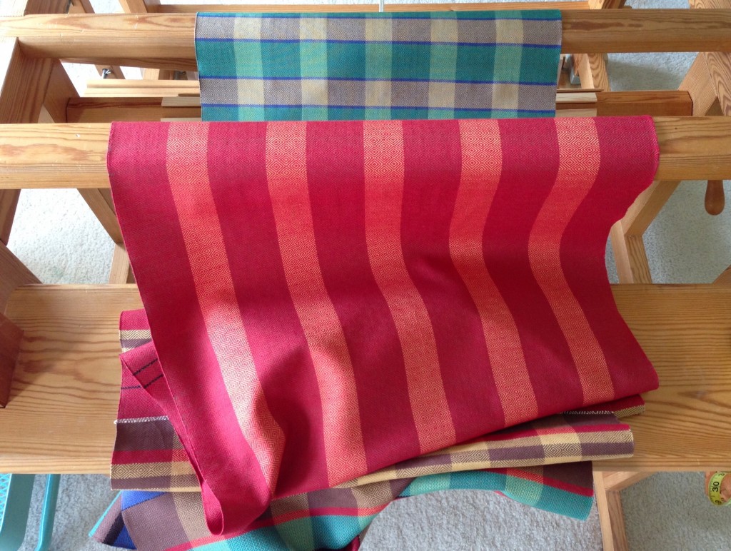 Red striped towel coming off the loom.