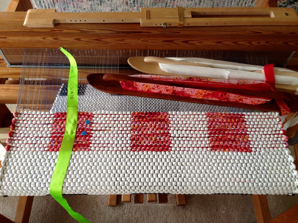 Nearing the end of Black and White and Red rag rug.