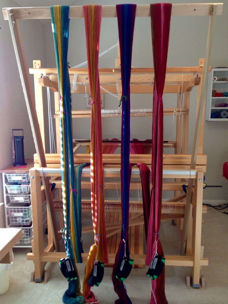 Colorful wool warp beamed using warping trapeze. Karen Isenhower
