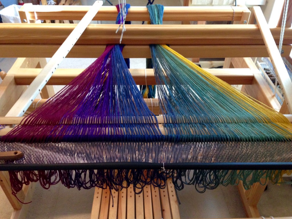 Bottom layer of double weave blanket is spread on the loom.