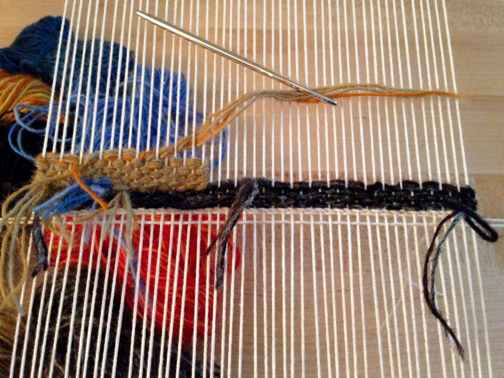 Weaving small tapestry from the back.