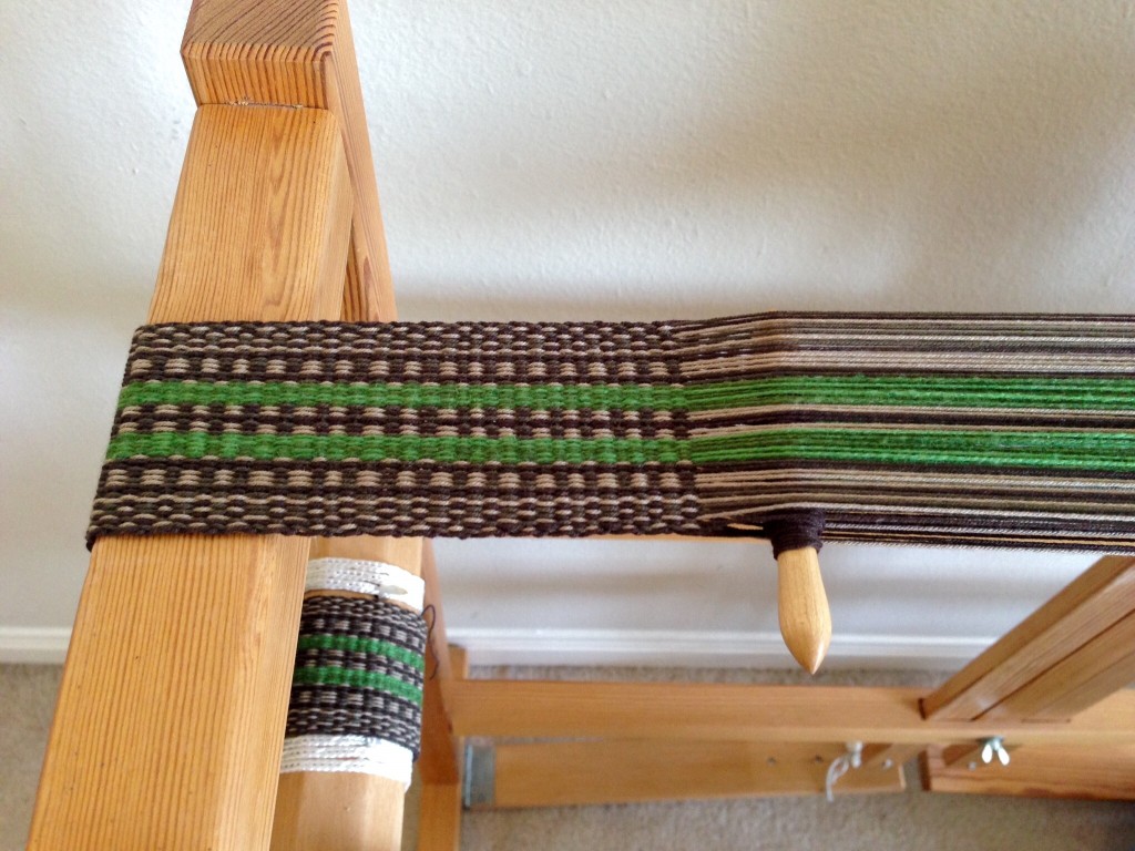 Weaving a sturdy strap on Glimakra band loom.