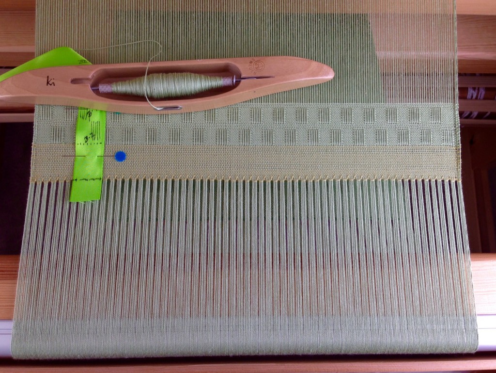 Cotton lace weave scarves on the loom. Fringe twisting info, too.