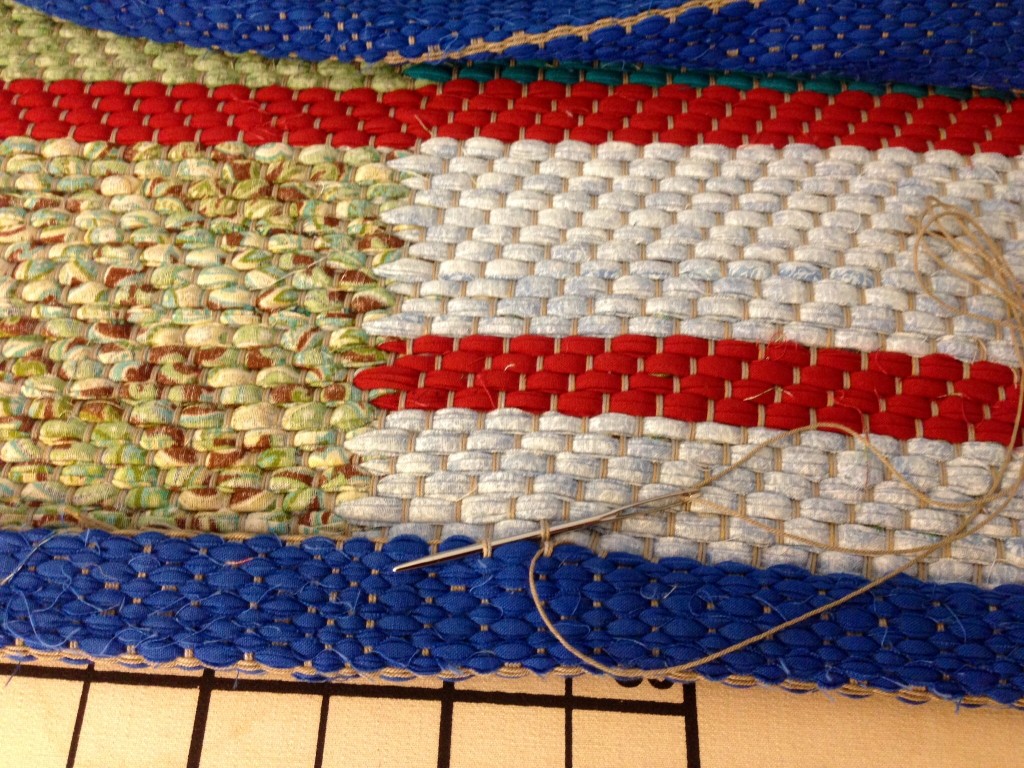 Hand-stitched rag rug hem.