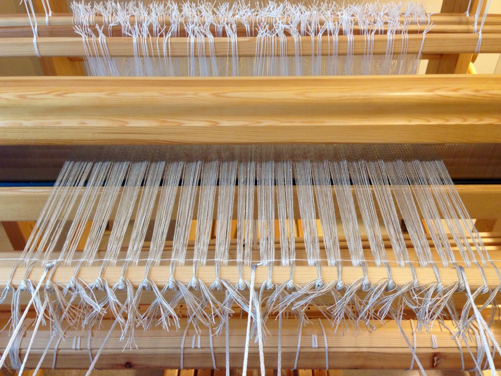 Getting ready to weave with linen. Tying on.