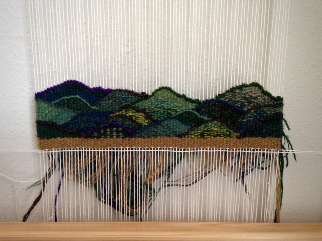 Small tapestry diary progress, woven from the back.