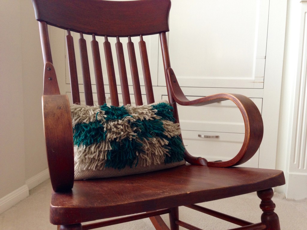 Great grandmother's rocking chair with new handwoven rya pillow.