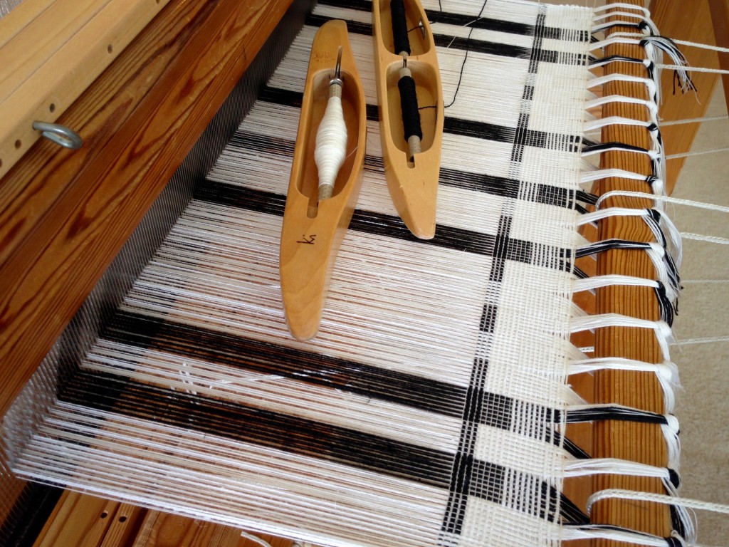 Black and white towels on the loom.