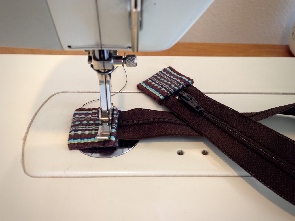 Handwoven tabs for ends of zipper tape.