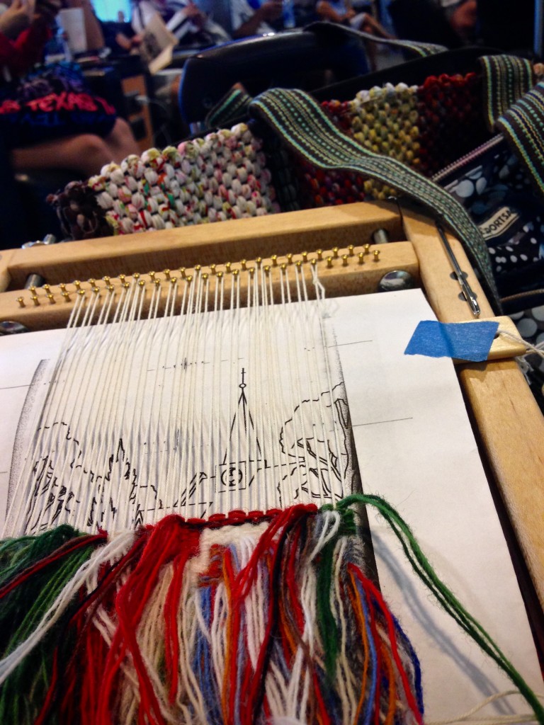 Weaving small tapestry while traveling.