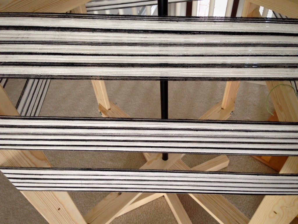 Warping reel with black and white warp.