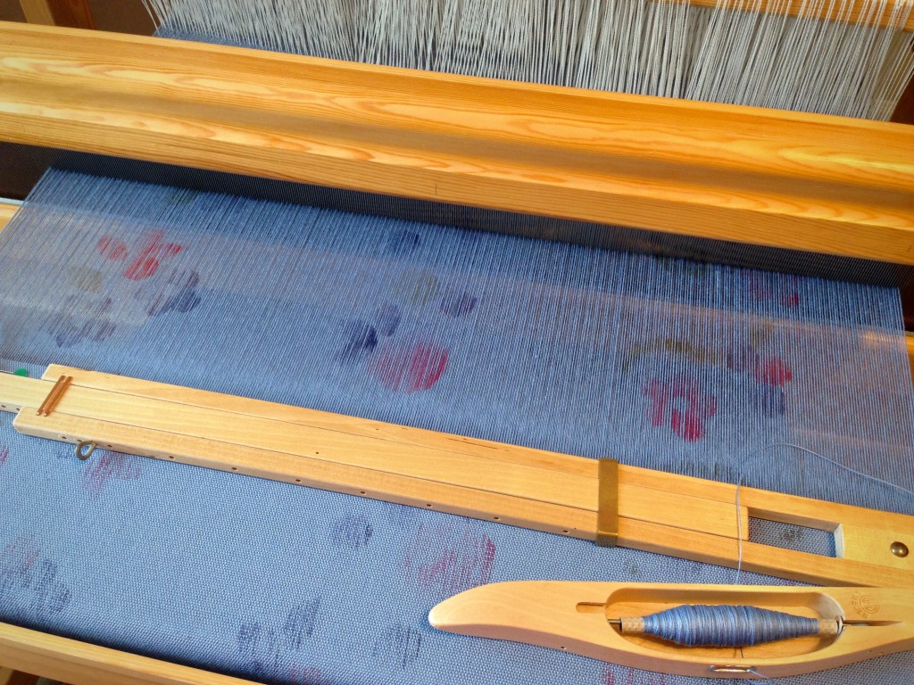 Stamped warp on the loom.