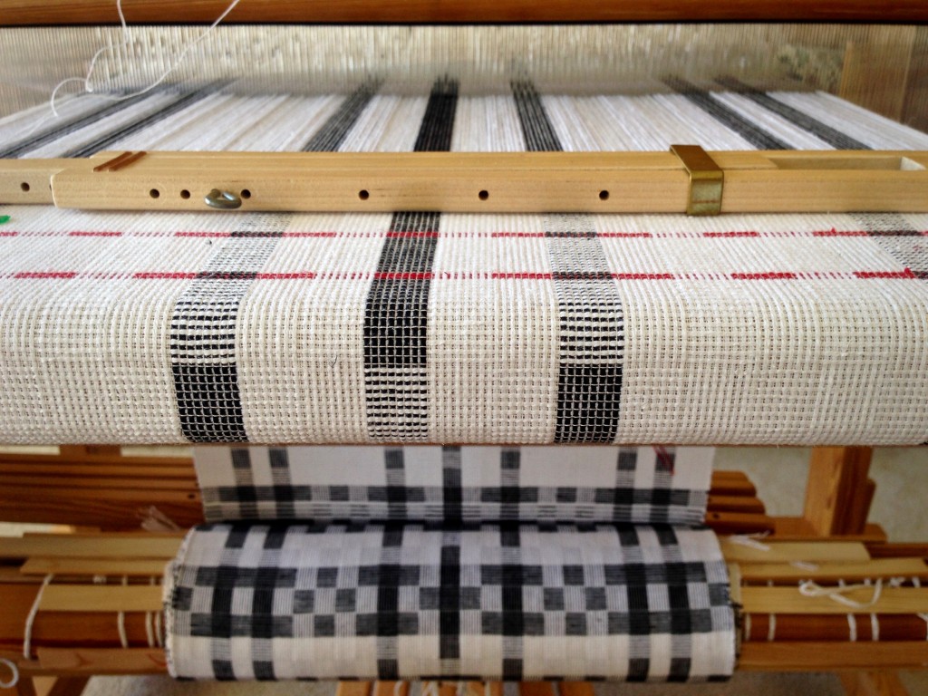 Thick and thin cottolin hand towels on the loom with interesting patterns.