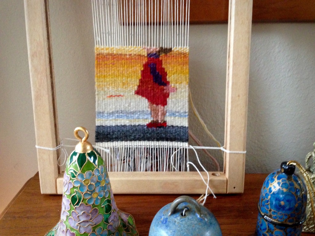 Little girl small tapestry progress.