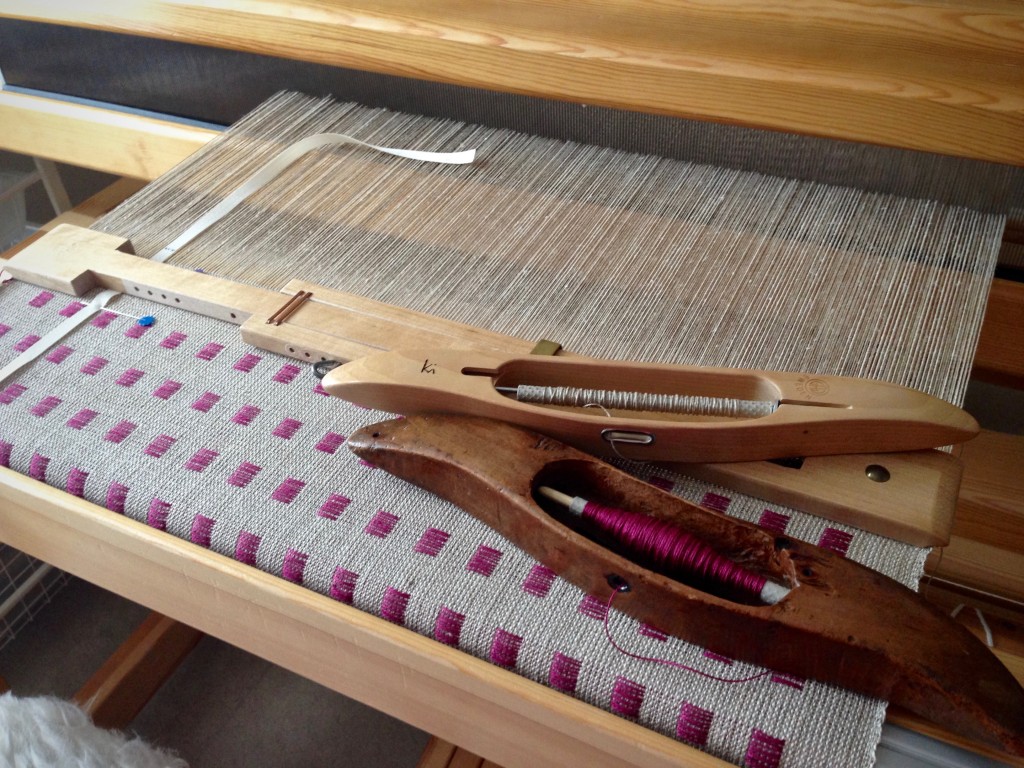 Linen dice weave on the loom.