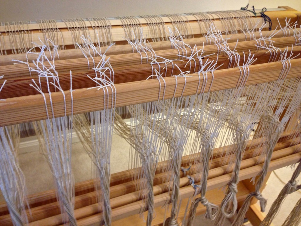 Threading the loom for rag rugs.