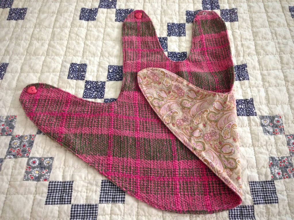 Baby girl pinafore made from handwoven fabric. Rigid heddle loom.