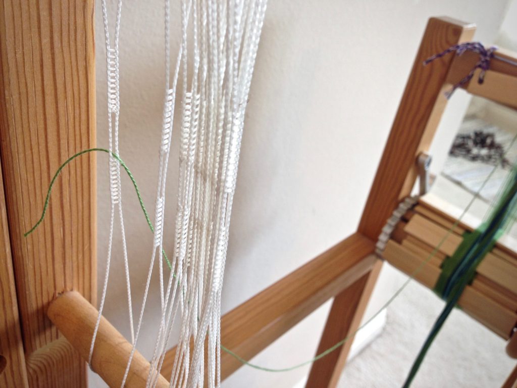 How to thread a band loom.