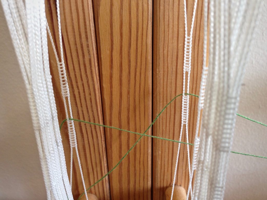 Threading the Glimakra band loom.