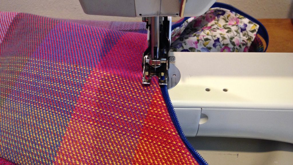 Making a handbag from handwoven fabric.