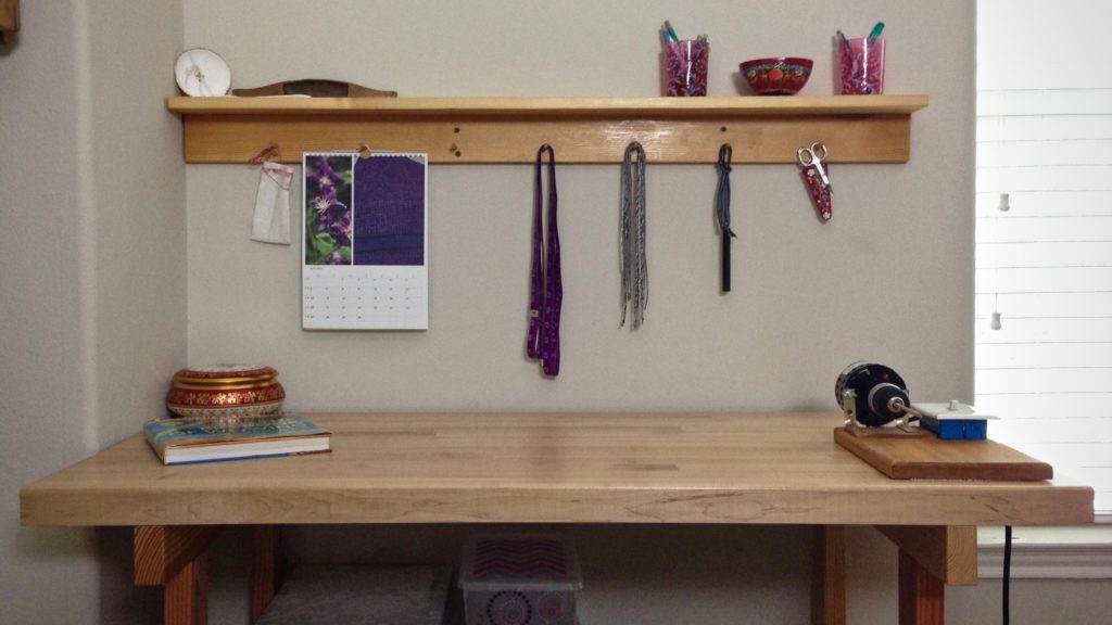 Hand-crafted maple shelf compliments the maple work table below.