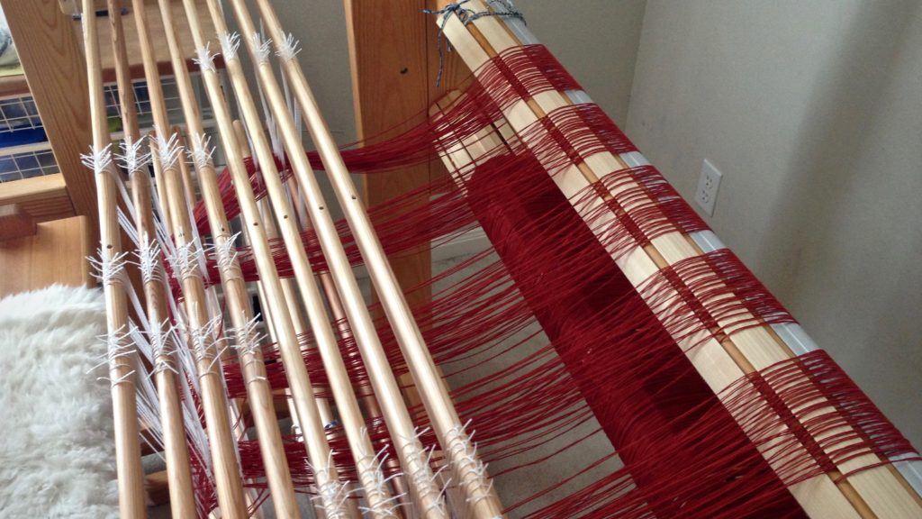 Threading the loom for an eight-shaft double binding rag rug.