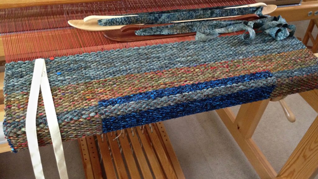 Double binding rag rug in the making.