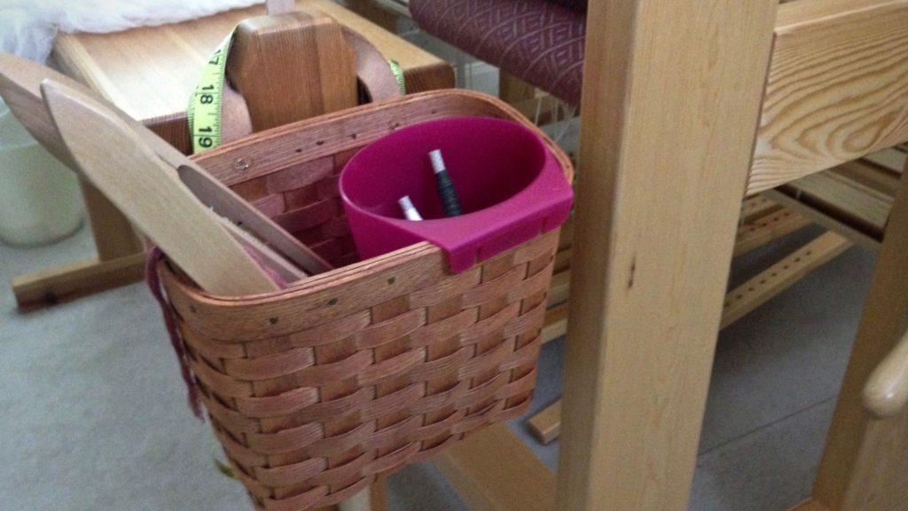 Loom bench basket with Ikea container inserted to hold quills.