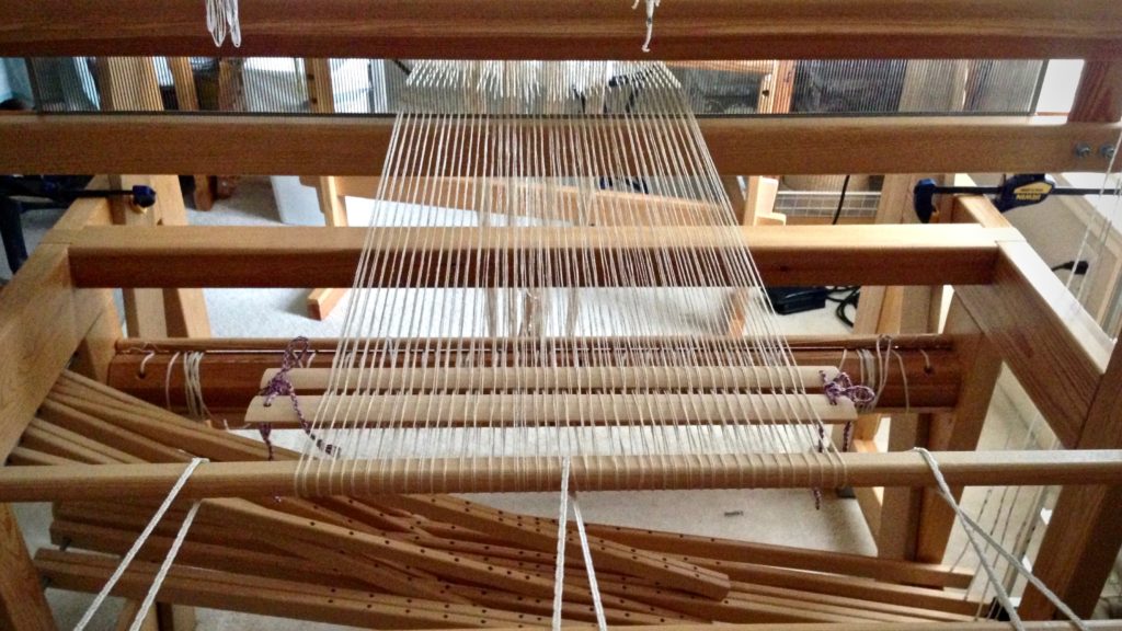 Beginning to beam a linen warp.