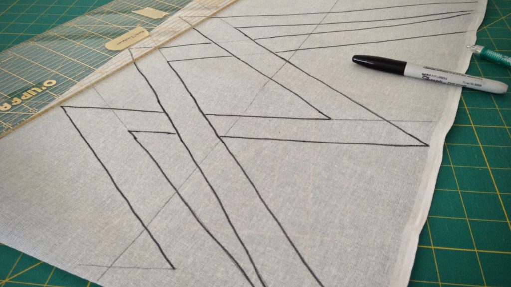 Drawing a cartoon on buckram for weaving a transparency.