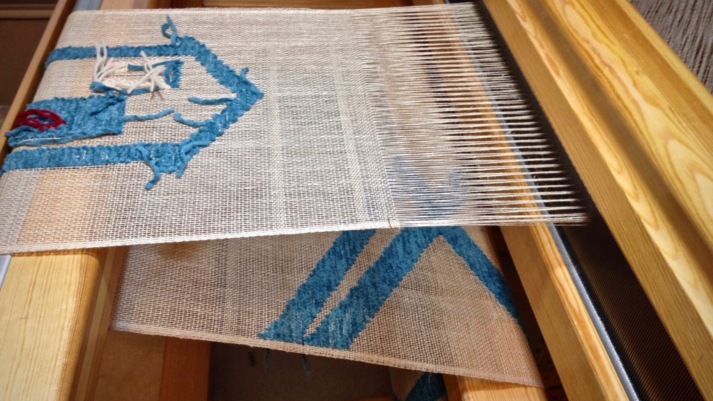 Transparency weaving. Linen warp and weft. Cotton chenille pattern weft.
