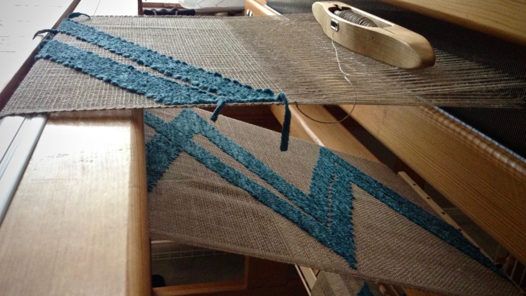 Weaving a transparency. Linen warp and weft. Cotton chenille pattern weft.