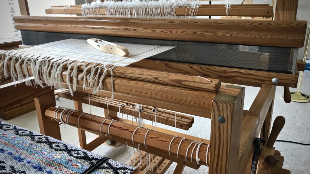 Beginning cotton warp with M's and O's.