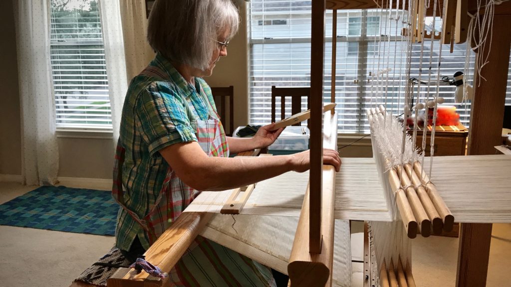 Sister comes to visit and gets her first weaving lesson.