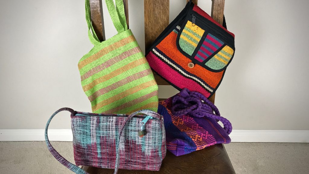 Handwoven handbags from international travels.