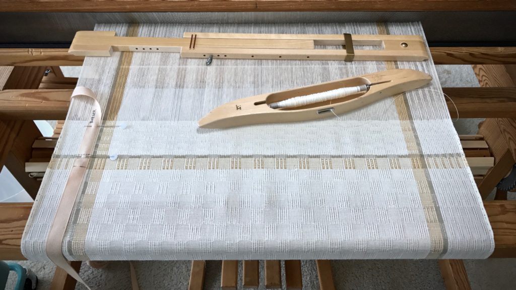 Weaving the border of the long table runner. M's and O's.