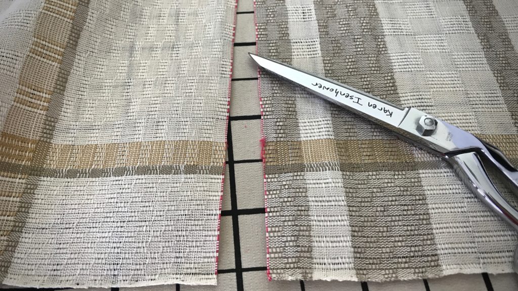 Cutting line between woven items.
